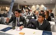 Students sitting at tables.